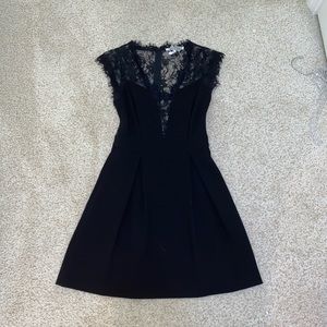 Lacy black dress with pockets